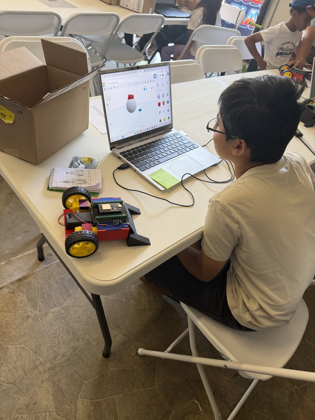 Students at robot competition arena
